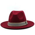 Close-up of wine red wool fedora hat with striped ribbon band and wide brim detail - Burgundy