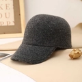 Detailed texture of dark grey wool blend baseball cap on warm beige velvet background - Dark Gray