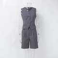 Detail of dark gray V-neck vest and matching tailored shorts on invisible mannequin - S / Gray
