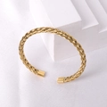 Detailed view of golden woven titanium steel bangle with polished rectangular ends - Gold 5