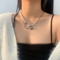 Elegant half pearl half silver chain necklace with heart pendant on model - I Love You Heart Patchwork Artificial Pearl Necklace (X1362)