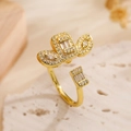 Elegant gold plated geometric open ring with sparkling zircon insets on stone surface - Adjustable Open / Leaf Rectangular Zirconia Style (14199)