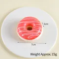 Pink PU artificial donut model with white icing swirls on a plate, 7cm diameter size - 7cm Diameter, 3cm Height / Strawberry Red