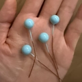 Set of four 10mm blue artificial berries on wire stems for DIY Christmas gift boxes - Sky Blue
