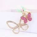 Sparkling crystal butterfly keychain in gold alloy with pink and white rhinestones - Pink