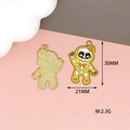 Detail of cartoon skeleton alloy pendant with size markings of 30mm height and 21mm width - Skull
