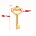 Macro detail of golden heart key pendant with precise 36mm by 15mm dimensions for DIY jewelry - Vacuum 18K Gold Hollow Heart Key Pendant 36mm
