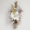 Christmas wreath with white magnolia flowers pine cones and festive gold ornaments - White Magnolia Wall Swag