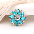Macro shot of blue marquise rhinestone flower accessory with gold-plated base detail - Lake Blue