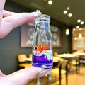 Floating clownfish liquid bottle ornament with purple sand and star sequins - Purple Clownfish [Tall Bottle]