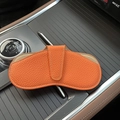 Portable orange lychee leather sunglasses pouch with metallic button and soft lining - Orange