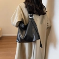 Black soft leather oversized shoulder bag with rivet straps and metal buckle detailing - Black