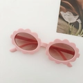 Pink floral-shaped round frame kids sunglasses with light brown lenses and wavy design - Pink