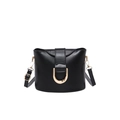 Retro black leather bucket crossbody bag with a prominent gold D-buckle closure - Black