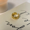 Macro shot of gold plated quilted pattern open ring with luxurious polished finish - Open (Gold) / Gold