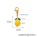Ciondolo limone in resina gialla con foglia di zircone e moschettone in acciaio dorato - Ciondolo Limone 3D Oro (D295)