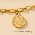 Macro detail of a gold-plated vintage coin pendant with crown and crest embossing - 145-Coin Relief