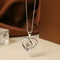 Silver-colored heart necklace in titanium steel with zircon inlay and mother-child silhouette - Steel Color Heart Necklace N0452S
