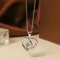 Silver-colored heart necklace in titanium steel with zircon inlay and mother-child silhouette - Steel Color Heart Necklace N0452S