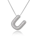 Close-up of silver letter U pendant with micro-pave cubic zirconia on box chain - Letter U