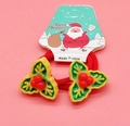 Christmas hair ties for kids with green holly leaves and red berry decor on a card - Holly Leaves