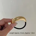 Golden minimalist metal hair tie with 5.5cm curved polished alloy buckle and black band - 1-Layer Gold