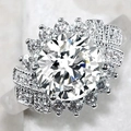 Macro shot of a luxury multi-layer silver ring with a large central diamond and halo setting - US 5 / White Gold