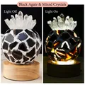 Black agate and white crystal night light on wooden base, shown lit and unlit - Black Agate + White Crystal Cluster