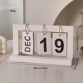 White wooden flip calendar with metal rings showing dimensions 20x11.5x9 cm and weight 163g - White