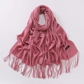 Pink cashmere scarf with fringe details and woven label on a plain white backdrop - Dusty Pink