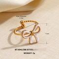 Golden stainless steel open ring featuring a white enamel bow design with size details - Bowknot Open Design Style (ZN1461)