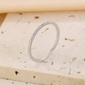 Elegant silver stainless steel ring featuring a row of sparkling embedded cubic zirconia - Full Pave Thin Style (KR106518-K)