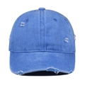 Close-up of blue distressed baseball cap with vintage frayed edges and torn hole detail - Light Blue