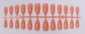 Detailed view of 24-piece nude almond-shaped press-on nails on a plastic runner tray - Translucent Flesh Pink (SD-12)