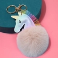 Llavero de unicornio brillante con pompón beige y tul colorido sobre fondo rosa - 9cm Encaje / Albaricoque