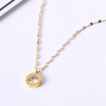 Detail of gold necklace pendant with roman numerals and sparkling crystal centerpiece - White Rhinestone Roman Necklace