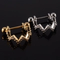 Golden and silver curved cartilage earrings with cubic zirconia on black reflective surface - NO 24