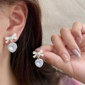 Elegant bow and heart pearl earrings with iridescent finish and pearl bead trim - White Bow Heart Iridescent Earrings