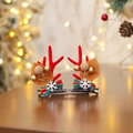 Christmas hair clips featuring red reindeer antlers and green striped festive bows - Golden Berry Antlers