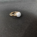 Detailed view of handmade gold wire-wrapped ring with round translucent gemstone bead - Adjustable Open / Aquamarine