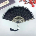 Elegant black lace folding fan with gold floral patterns and long black tassel - Double Layer Black Lace Fan - With Tassel