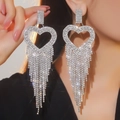 Detailed view of silver heart-shaped dangle earrings with sparkling crystal tassels - Heart Tassel (BXE035S) / Silver