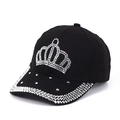 Detailed close-up of a black baseball cap with crystal crown design and studded brim - Adjustable / Black