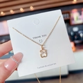 Elegante goldene Titanstahlhalskette mit hohlem Bärenanhänger und kleiner Schleife - Schleifen-Bären-Strass-Stil (X187) / 18K-Gold / Gold