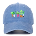 Detailed close-up of vibrant vegetable embroidery on vintage washed blue cotton baseball cap - Light Blue