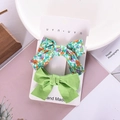 Detail of floral and solid light green fabric bow hair clips for girls set of two - Green Floral Set