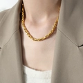 Elegant gold-plated twisted link chain necklace displayed on a female model - 40+5cm / Gold Necklace