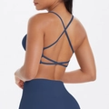 Detail of navy blue sports bra with thin criss-cross back straps and high waist yoga pants - S / Navy Blue
