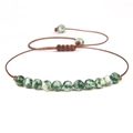 Macro shot of 4mm marble-patterned stone beads on an adjustable woven bracelet cord - Green White Marble/FD8442