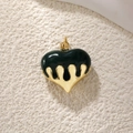Detail view of heart pendant with deep green enamel and golden melting metal drops - Medium 3D Dark Green